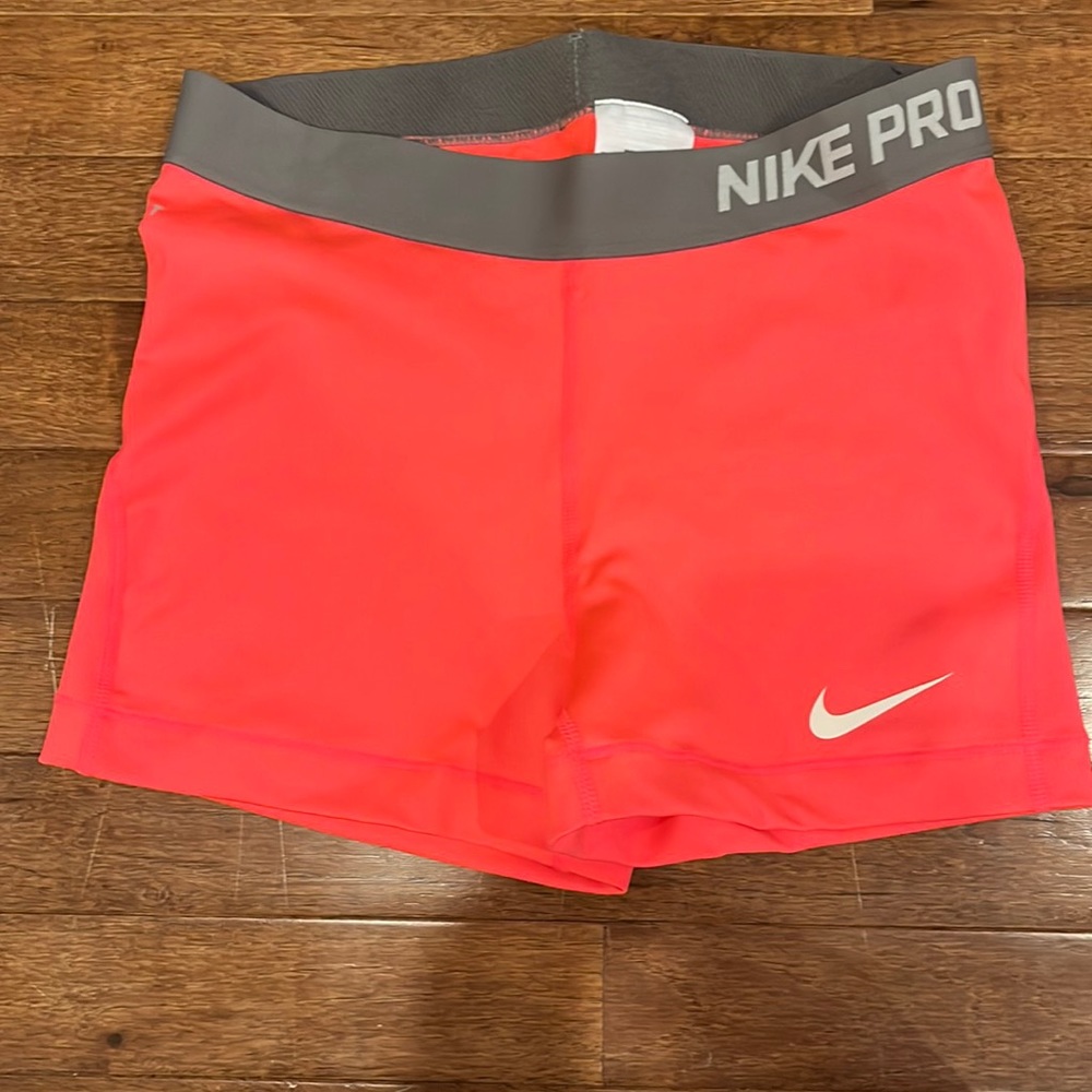 NEVER WORN Nike Pro size Medium, 2.5 inch inseam. PINK/GREY